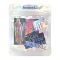 A silver resealable pouch with a variety of stickers inside.