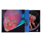 A vinyl record sleeve and inner sleeve. The artwork features a distorted, neon-toned close-up face, with a blue vertical band and dark text.